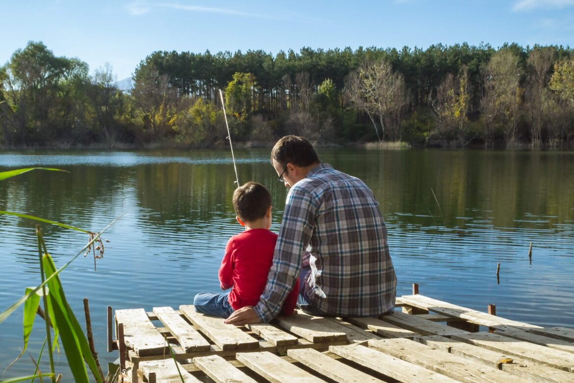 A boy and a man Fishing In Minnesota.